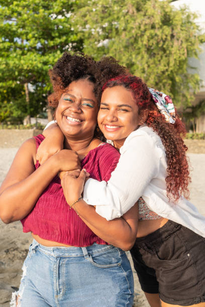 istock female friends looking happy together 1492577454