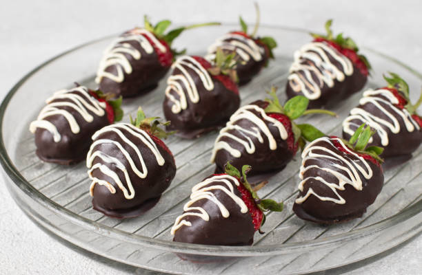 istock Delicious chocolate covered strawberries on gray background 1492578654