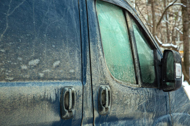 istock side doors of a cargo minibus with handles and a window covered with a layer of dried dirt and dust, a rear-view mirror with a turn signal is dirty. 1492579303