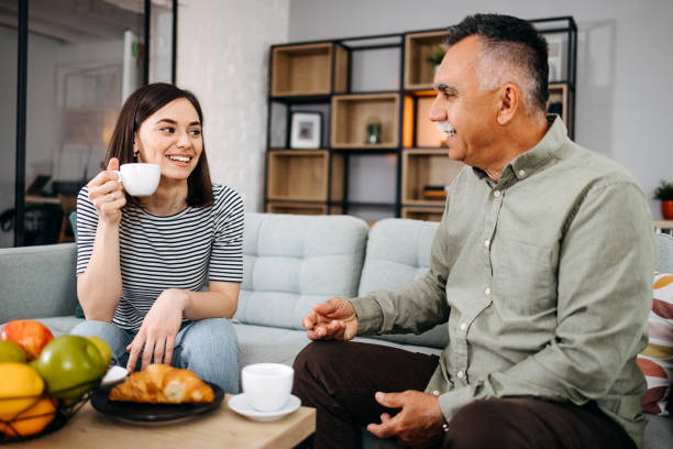 istock Grandfather and granddaughter enjoy coffee 1492579695