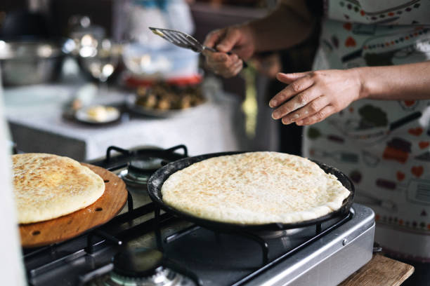 istock Cooking Khachapuri in Skillet on Stovetop 1492580075