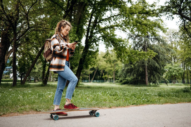 istock Young woman rides a skateboard 1492581768