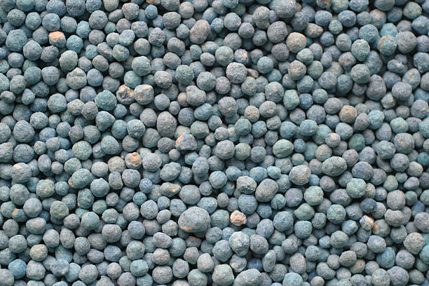 A closeup view of a pile of bluish-grey fertilizer stock photo