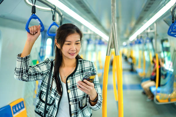 istock Woman riding commuter train to work 1492582922