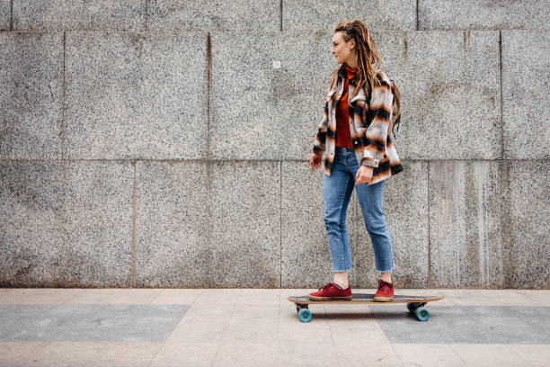 istock Woman riding a skateboard 1492584198