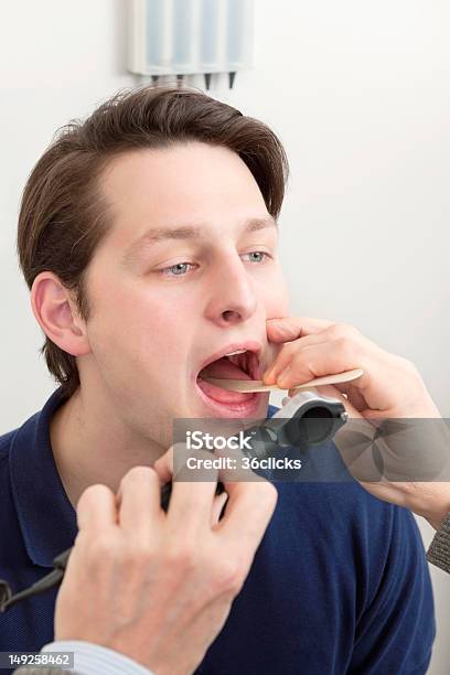 Examining Infection In The Mouth Stock Photo - Download Image Now - 20-29 Years, Adult, Adults Only