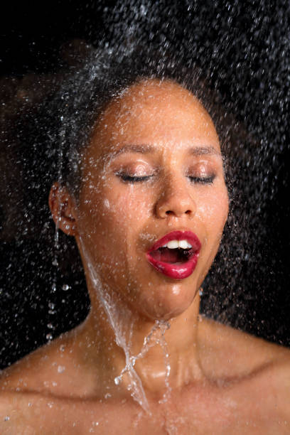 istock African american woman under shower 1492584653