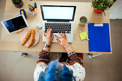 Woman working on laptop from home