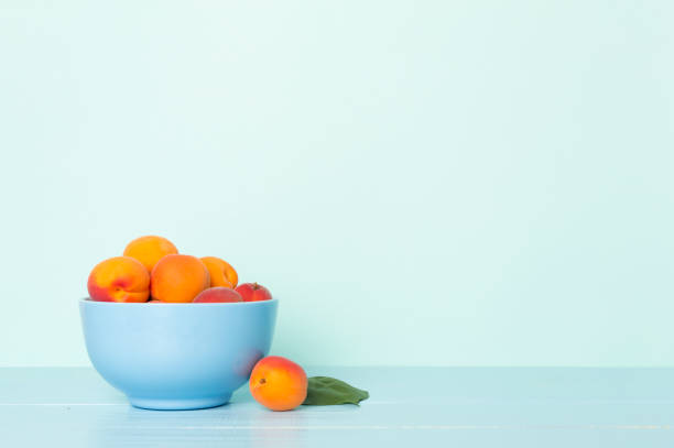 istock Composition with ripe apricots on wooden table 1492586099