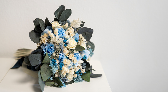 Bridal bouquet with blue and white roses