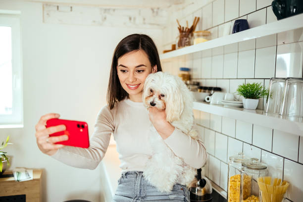 istock Woman takes a selfie with her dog 1492588919