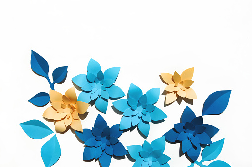 beautiful blue paper flowers, decor for decoration, stylish background for holidays.