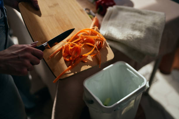 istock The cook throwing food leftovers from a cutting board in a compost bin. Responsible female person recycling organic waste at home in a bokashi container with ferment. Sustainable lifestyle concept 1492593057