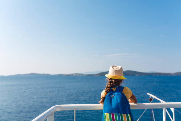 istock Child standing on a view point in a ferry and looking at the sea 1492597557