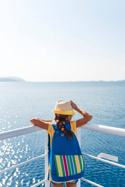 istock Child standing on a view point in a ferry and looking at the sea 1492597568