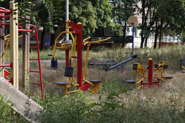 istock Depicted is an abandoned, overgrown sports ground with various simulators for training the body and muscles. 1492599303