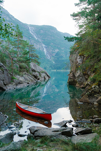 Scenic view of red canoe on the lake in Norway