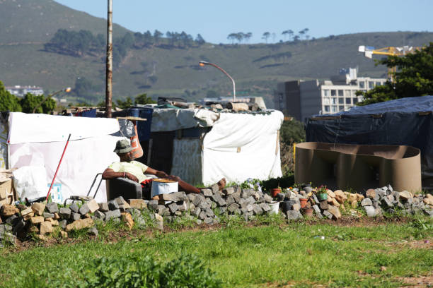 A temporary shelter made of metal sheets, fabric, and tarpaulin in an informal settlement in Uganda. The image highlights challenges of poverty, inadequate housing, and urban resilience among low-income communities.