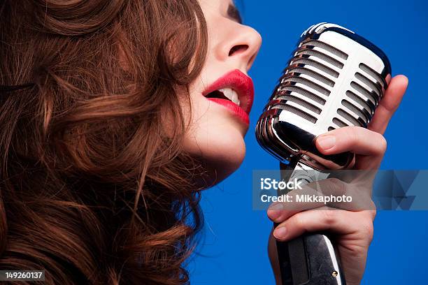 Woman With An Old Fashioned Microphone Stock Photo - Download Image Now - Females, Human Face, Singer