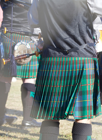 closeup view of the pipes on a bagpipe.