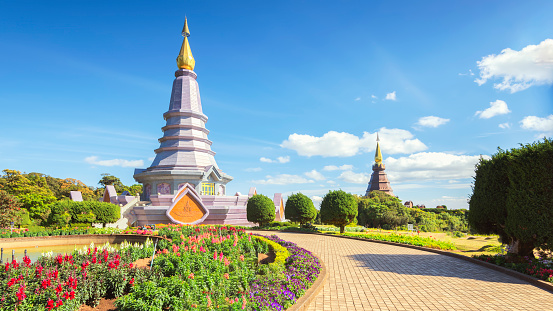 Thailand - January 8, 2020 : Scenic landscape of flower garden with Phramahathat Napamathanidol and Phramahathat Napaphol Bhumisiri  Pagodas background on Doi Inthanon Mountain, Chiangmai