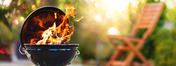 istock Barbecue grill with fire on open air 1492604772