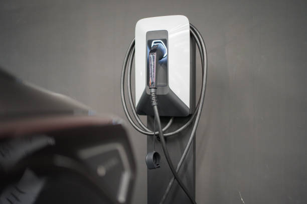 istock Electric vehicle, external charger 1492604872