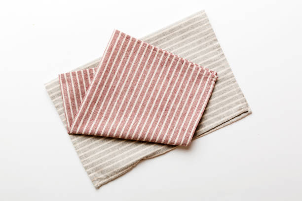 istock top view with red empty kitchen napkin isolated on table background. Folded cloth for mockup with copy space, Flat lay. Minimal style 1492605212