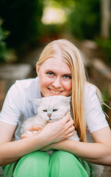 istock Young Woman and Her Beautiful Cat 1492606367