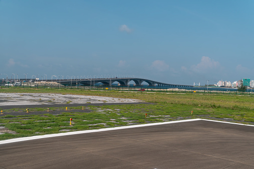 view of the China-Maldives friendship bridge, the Sinamale bridge, connecting the island of Hulhule with the capital island of Male in the Maldives. view from the airport runway.