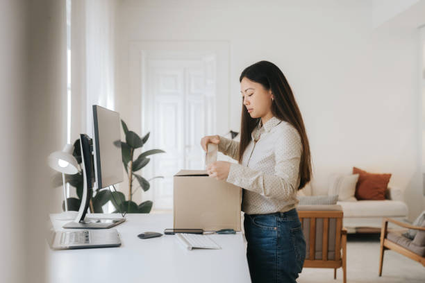 istock Young businesswoman works at home orders package 1492609917