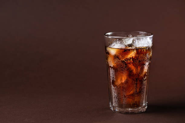 istock A glass of cola drink with ice cubes. 1492613229