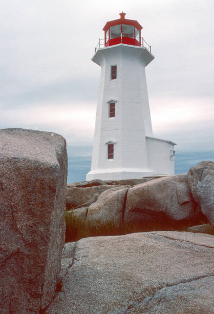 istock Peggy's Cove Lighthouse & Foreground Rocks Vertical - 1994 1492613366