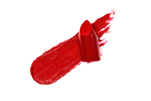 Red lipstick swatch isolated on white background. Brush stroke of lipstick for design.