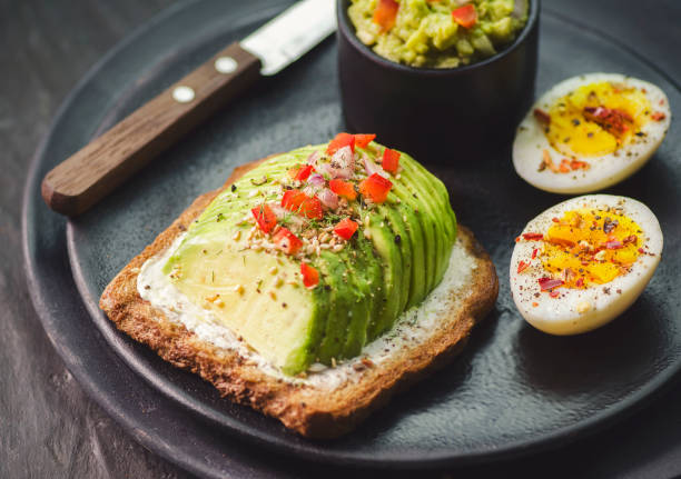 istock Wholegrain Toast with Avocado and Creamy Cheese 1492615782
