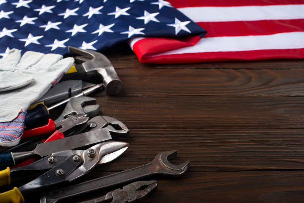 istock Tools and us flag on wooden background labor day banner mockup with copyspace 1492617356