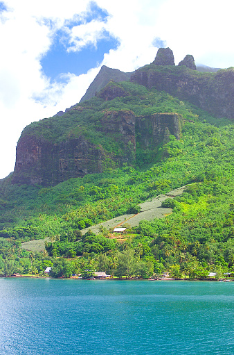 Moorea, French Polynesia - 2001: A view of the lush mountain island of Moorea in French Polynesia with blue clear water on the rare Canon EOS 1N - Kodak DCS 520, one of the first professional digital cameras.