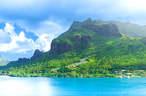Moorea, French Polynesia - 2001: A view of the lush mountain island of Moorea in French Polynesia with blue clear water on the rare Canon EOS 1N - Kodak DCS 520, one of the first professional digital cameras.