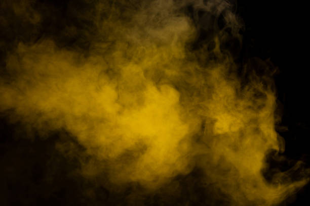 istock Yellow steam on a black background. 1492626285