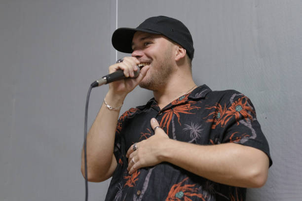 istock a low angle photo of a rock singer smiling with malice while singing during a rehearsal 1492626370