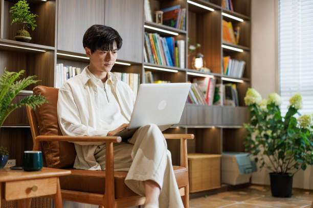 istock white-collar workers work with laptops in the living room 1492626771