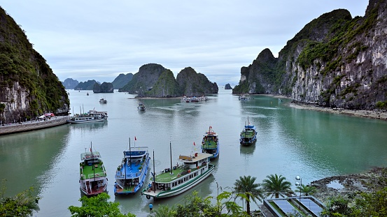 Ha Long Bay is located in Ha Long City, Quang Ning Province, Vietnam. It is a typical limestone karst landform bay. The whole bay has about 120 kilometers of coastline, a total area of about 1553 square kilometers, and about 2000 islets.\nAbout 434 square kilometers of the central area (containing 775 islets) is a World Natural Heritage Site. The scenery is beautiful and charming.\nIt is a national scenic spot in Vietnam. Countless foreign tourists come here for sightseeing.\nThe photos were taken from the top of an island in Ha Long Bay.