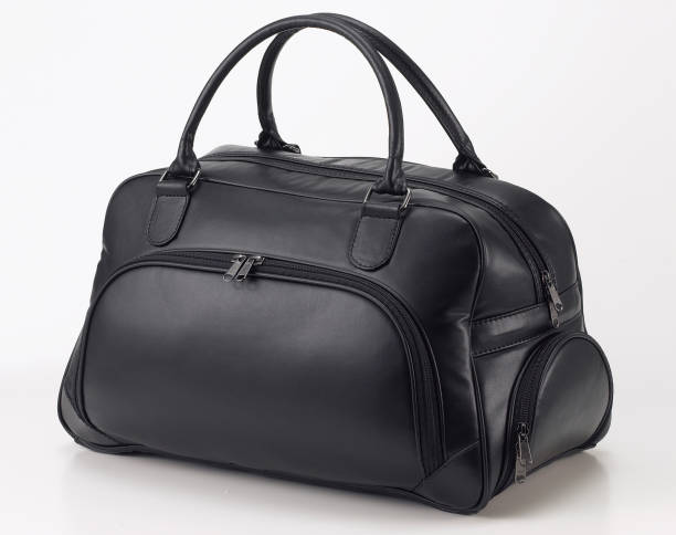 istock Black leather travel bag or duffle bag isolated on white background 1492635192