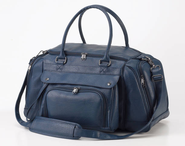 istock Blue leather travel bag or duffle bag isolated on white background 1492635227
