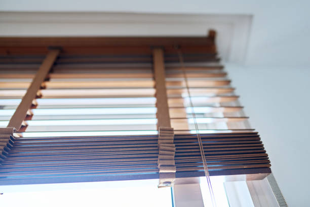 istock Brown wooden blinds in the interior close-up 1492635508