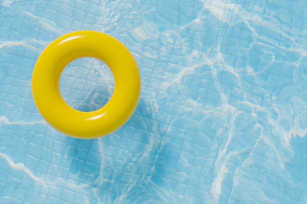 istock Yellow round donut pool float in a bright blue swimming pool 1492638859