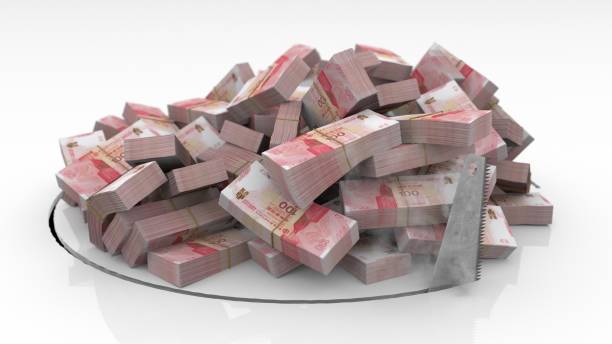 istock Hong Kong banknotes falling through a hole cut on the floor with a saw 1492640902