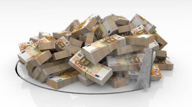Euro banknotes falling through a hole cut on the floor with a saw
