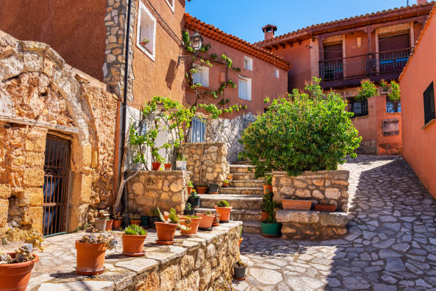Picturesque street with old houses in one of the most beautiful villages of Zaragoza, called Anento. Picturesque street with old houses in one of the most beautiful villages of Zaragoza, called Anento ancient villages stock pictures, royalty-free photos & images
