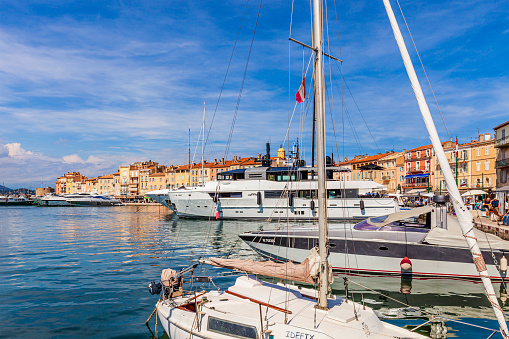 Luxury yachts are moored at the port of Saint-Tropez, one of the most visited and glamour cities in the French Riviera